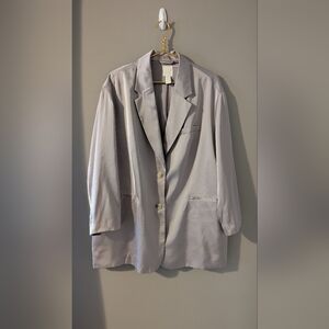 Beautiful very over sixed silky silver/gray long blazer. Comes with two buttons.